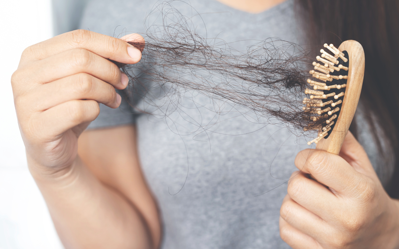 I'm a woman experiencing hair loss for the first time - what should I do?